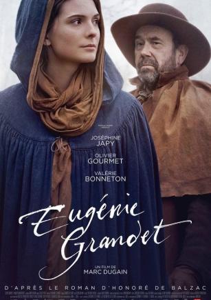 Una mujer y un hombre detrás.